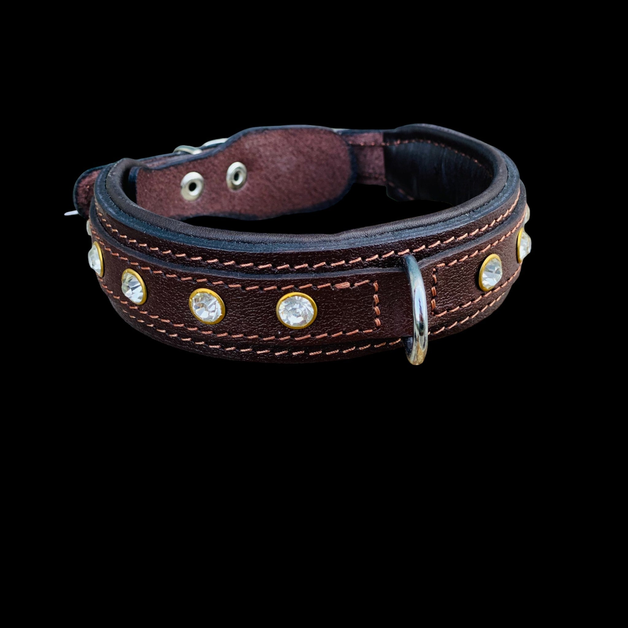 Angled photo of brown leather dog collar with crystal embellishments and durable hardware.
