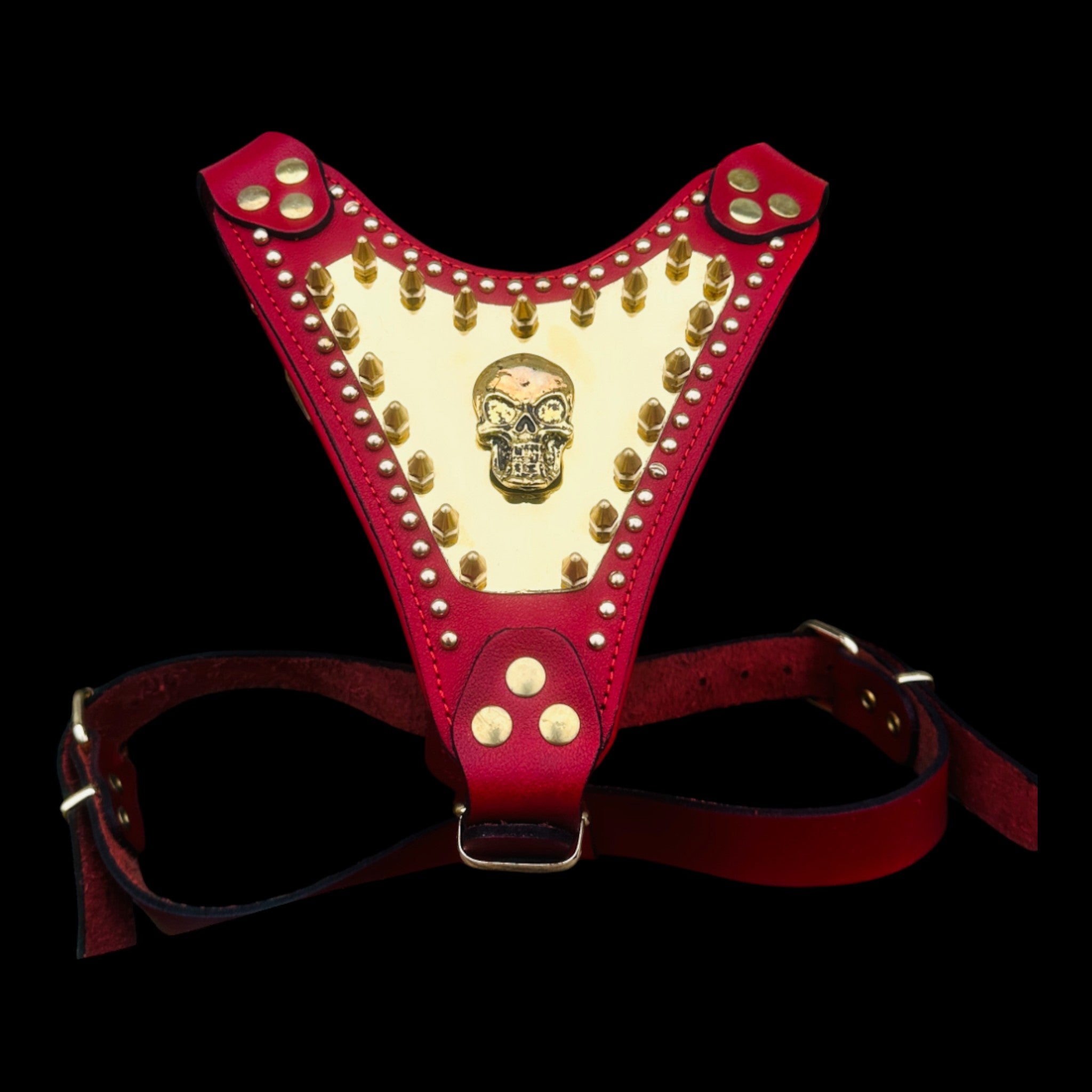Red leather dog chest harness with gold skull logo and studs