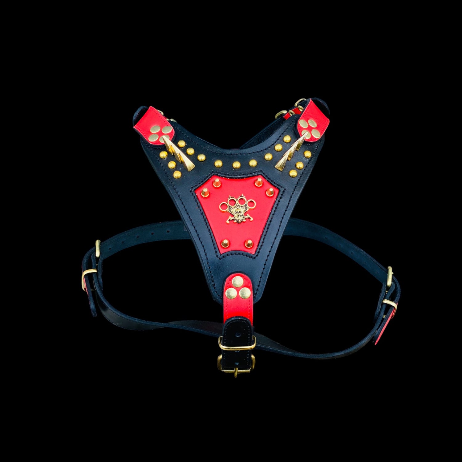 Handmade spiked chest harness with brass knuckle emblem
