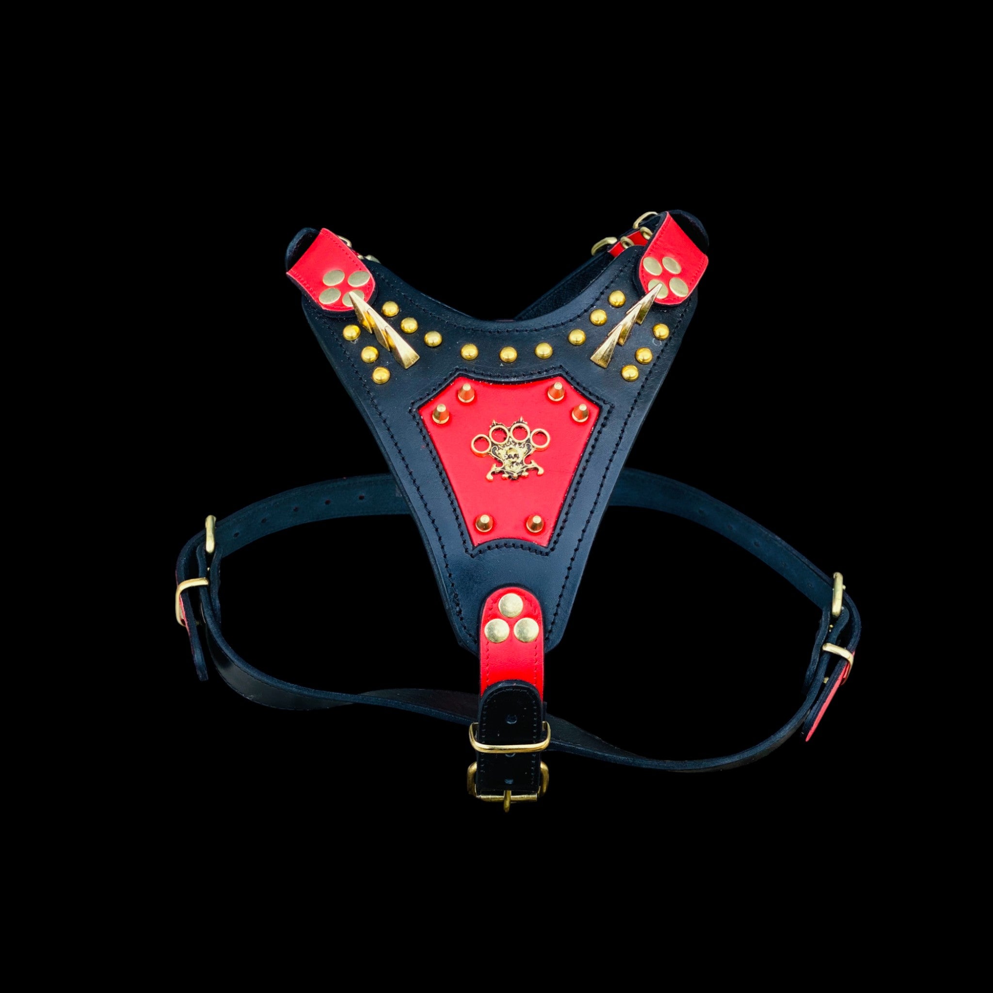 Handmade spiked chest harness with brass knuckle emblem