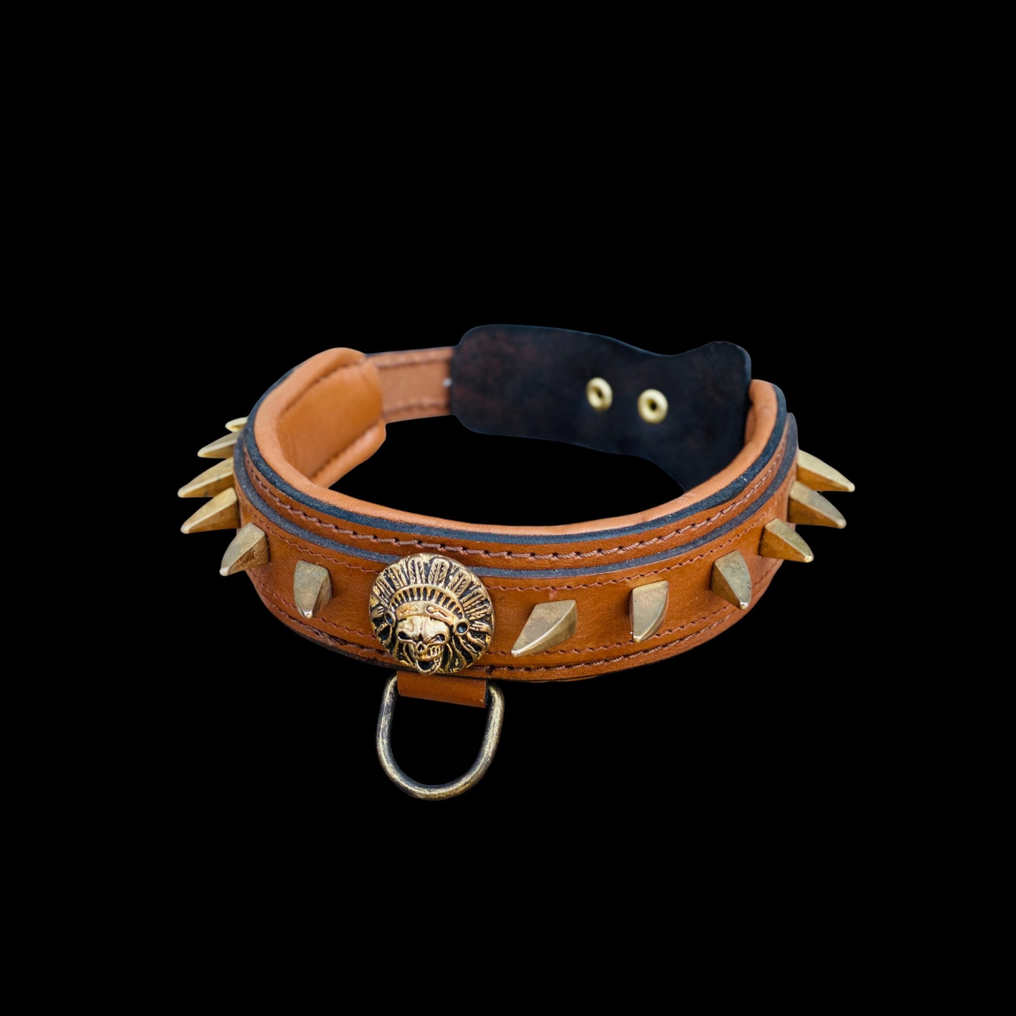 Detail view of heavy duty steel D-ring on handmade spiked leather dog collar