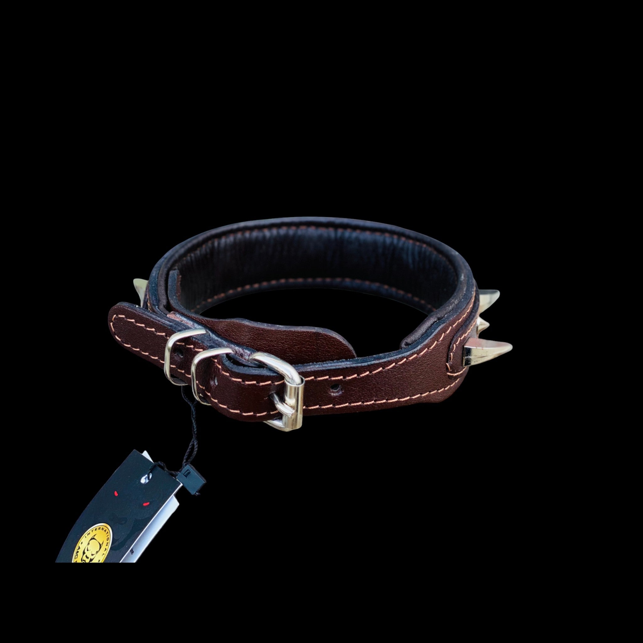 Side view of wide 4 cm spiked brown leather dog collar featuring reinforced stitching, metal spikes and stainless steel D-ring