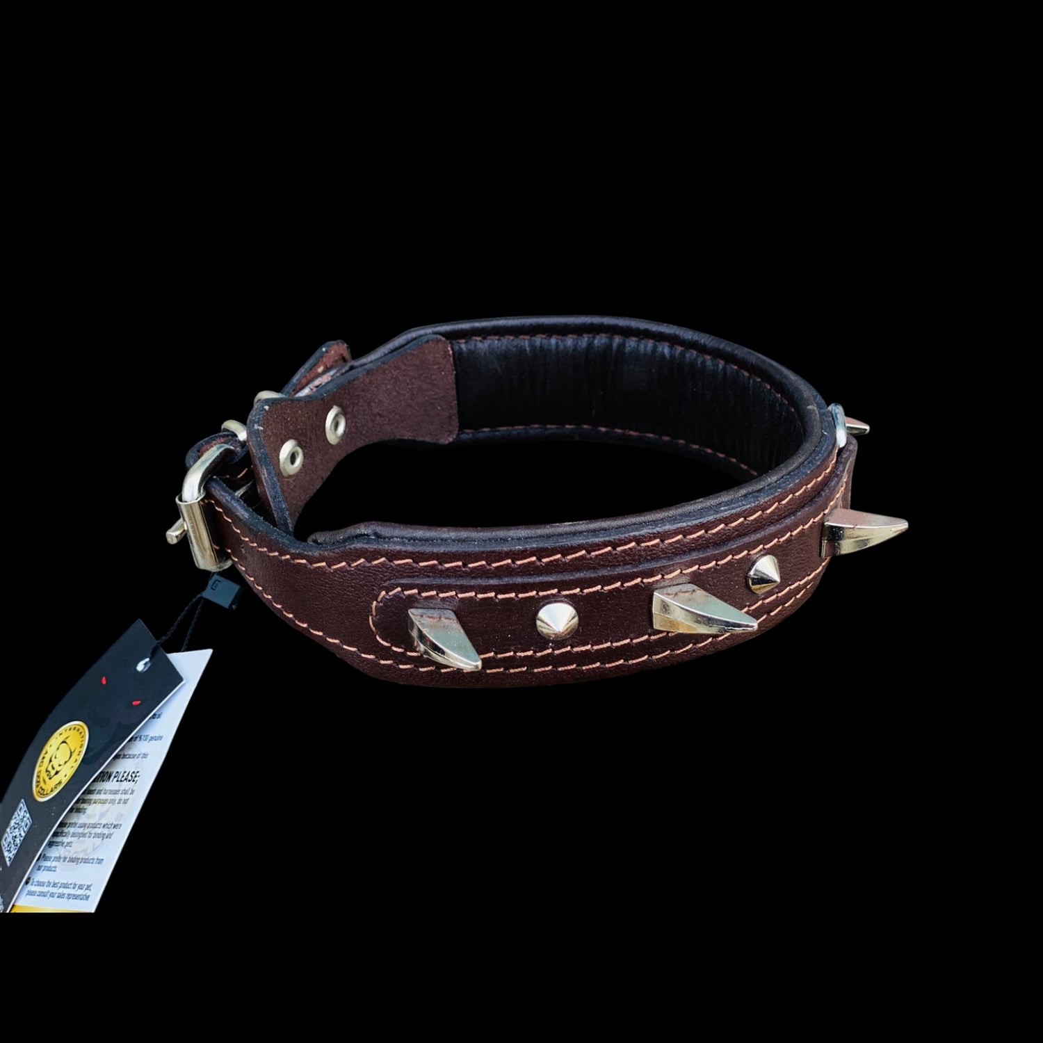 Angled photo of 4 cm wide brown leather dog collar with strong metal spikes and secure steel D-ring for large powerful breeds