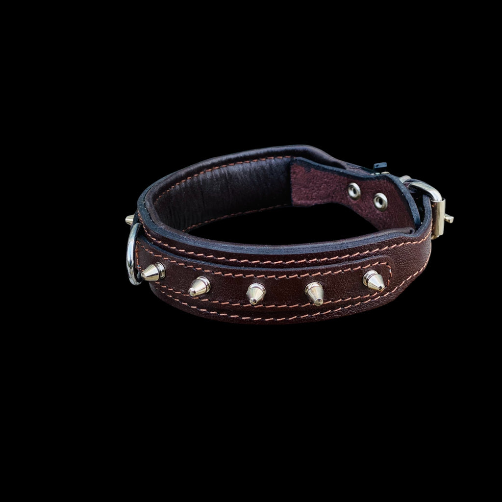 Close-up detail of brown leather spiked dog collar showing strong stitching, steel spikes and premium handmade craftsmanship