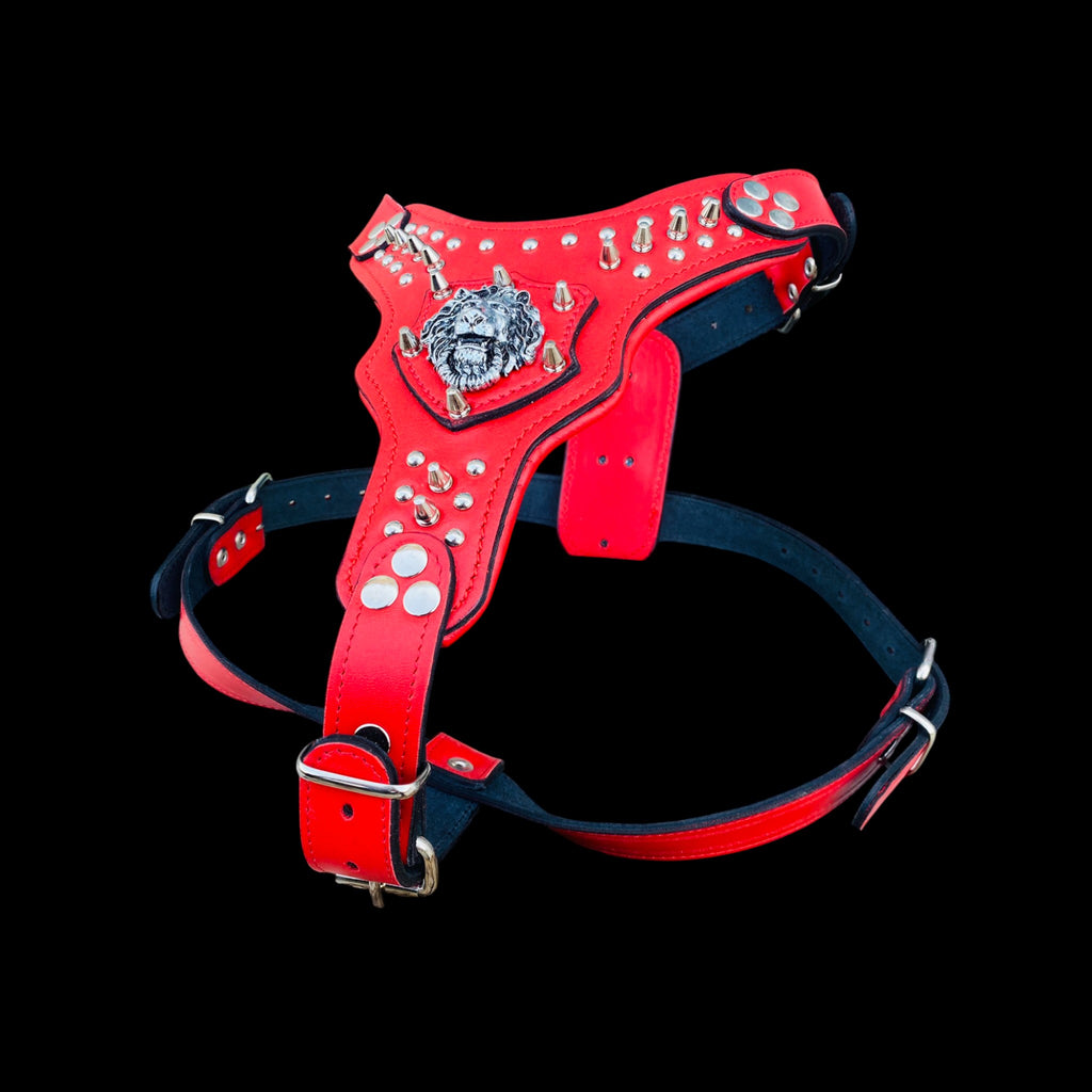 Handmade red leather dog harness with lion logo and spikes