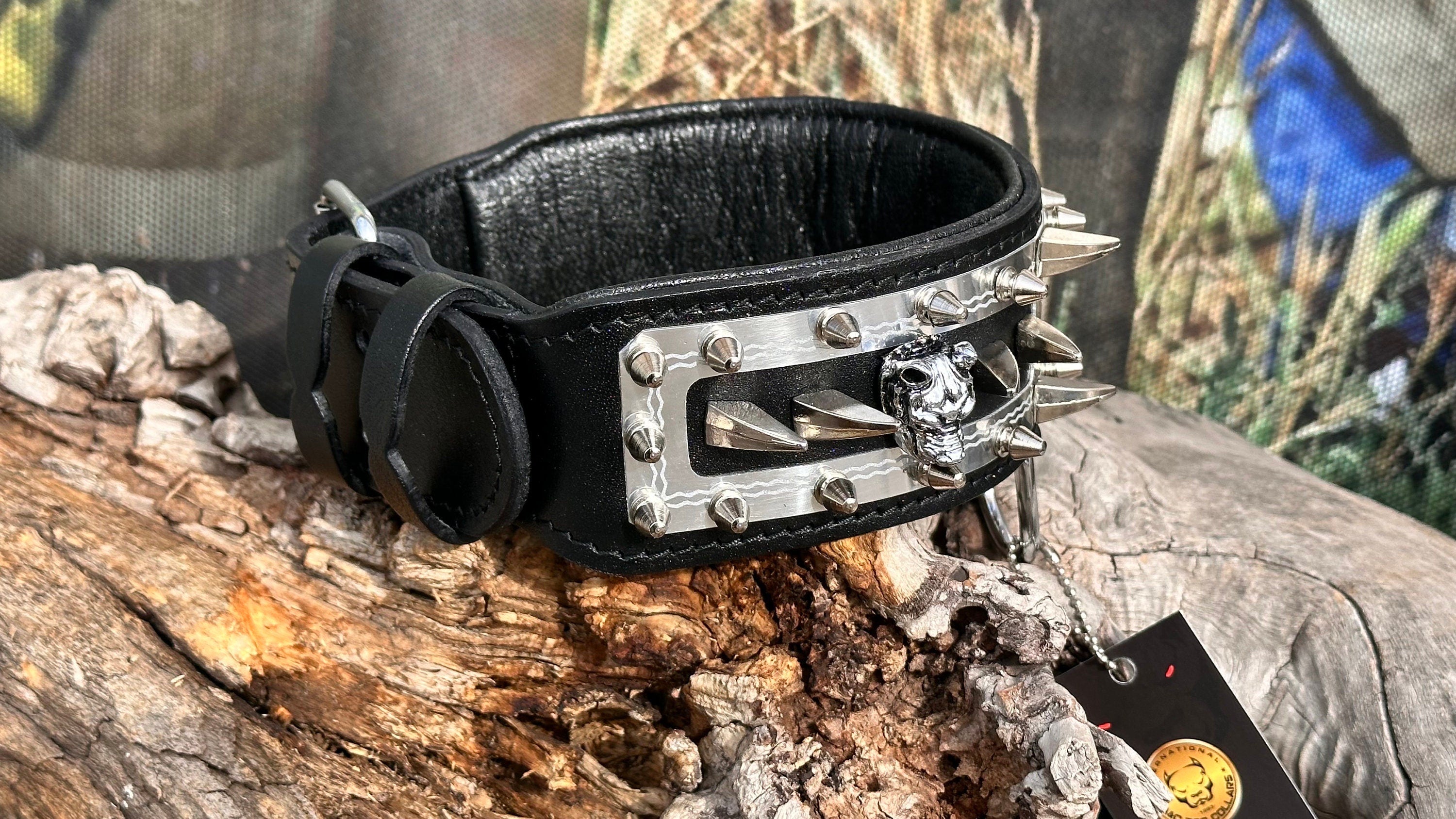 Handmade leather dog collar with a custom engraved metal name plate, featuring durable craftsmanship and adjustable fit.