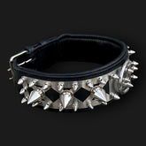 Handmade spiked leather dog collar with custom engraved name plate from A&C Dog Collars, showing detailed spikes and engraved plate.