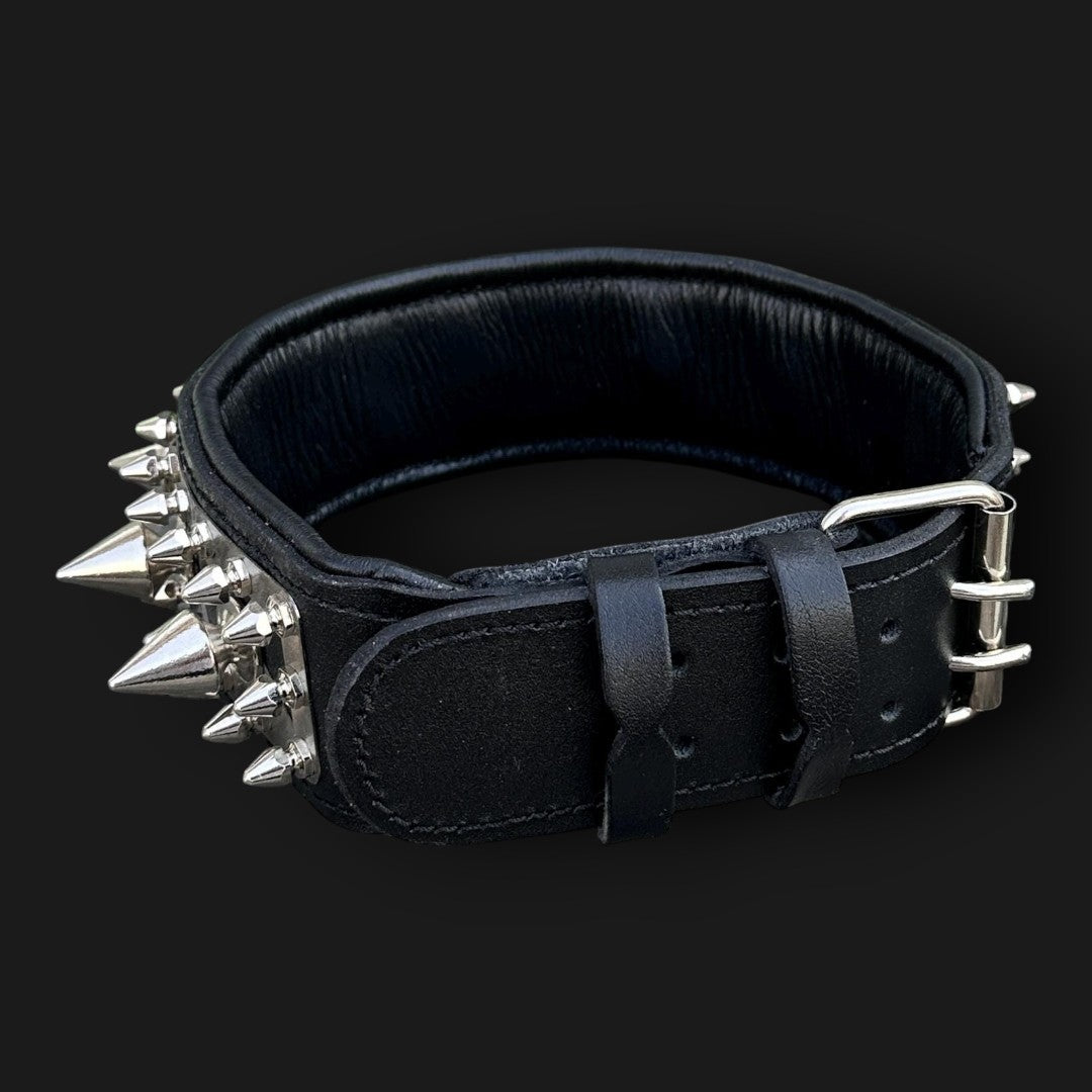Handmade spiked leather dog collar with custom engraved metal name plate from A&C Dog Collars, featuring sturdy spikes and adjustable fit.