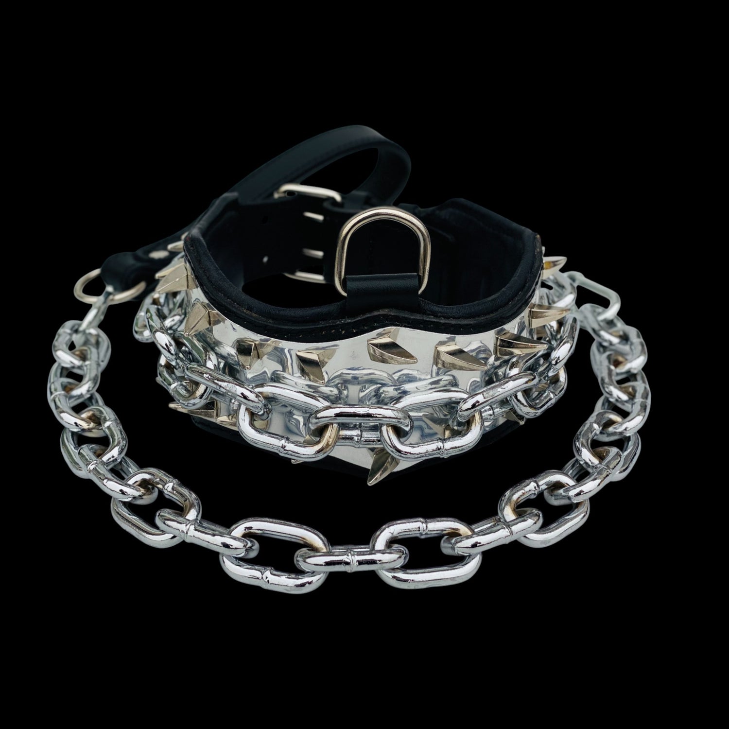 Close-up of steel chain and spike details on dog collar